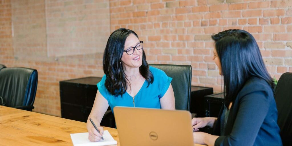 Woman talking with laptop
